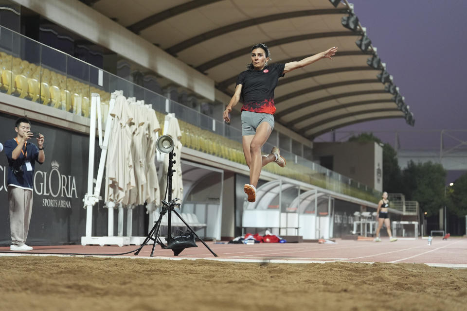 Olympic athlete in flight doing the long jump