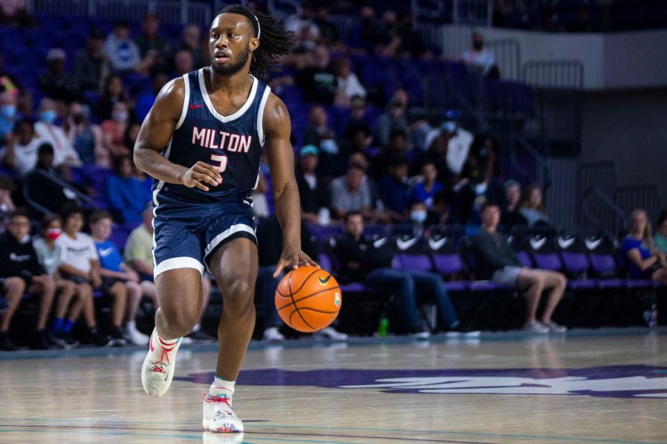 Milton HS' Bruce Thornton (2) dribbles the ball during the 48th annual City of Palms Classic between IMG Academy and Milton HS on Wednesday, Dec. 22, 2021 at the Suncoast Credit Union Arena in Fort Myers, Fla. 