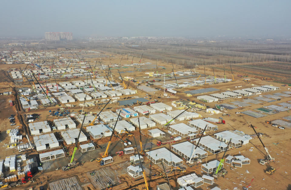 In this aerial photo released by China's Xinhua News Agency, workers build a large centralized quarantine facility capable of holding several thousand people in Shijiazhuang in northern China's Hebei Province, Saturday, Jan. 16, 2021. China on Saturday finished building a 1,500-room hospital for COVID-19 patients in Nangong, south of Beijing in Hebei Province, to fight a surge in infections the government said are harder to contain and that it blamed on infected people or goods from abroad. (Yang Shiyao/Xinhua via AP)