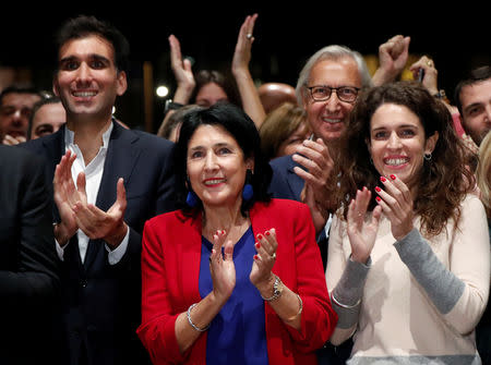 Salome Zurabishvili, presidential candidate supported by the governing Georgian Dream party, with her daughter Ketevan and son Teimuraz react after the announcement of the first exit polls in the presidential election in Tbilisi, Georgia October 28, 2018. REUTERS/David Mdzinarishvili