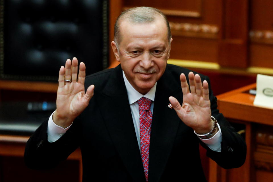 Turkish President Recep Tayyip Erdogan gestures after delivering his speech at the Albanian Parliament, in Tirana, Albania, January 17, 2022. REUTERS/Florion Goga