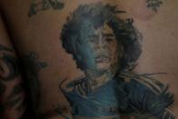 The Wider Image: Argentines celebrate 'eternal love' for Maradona with tattoos