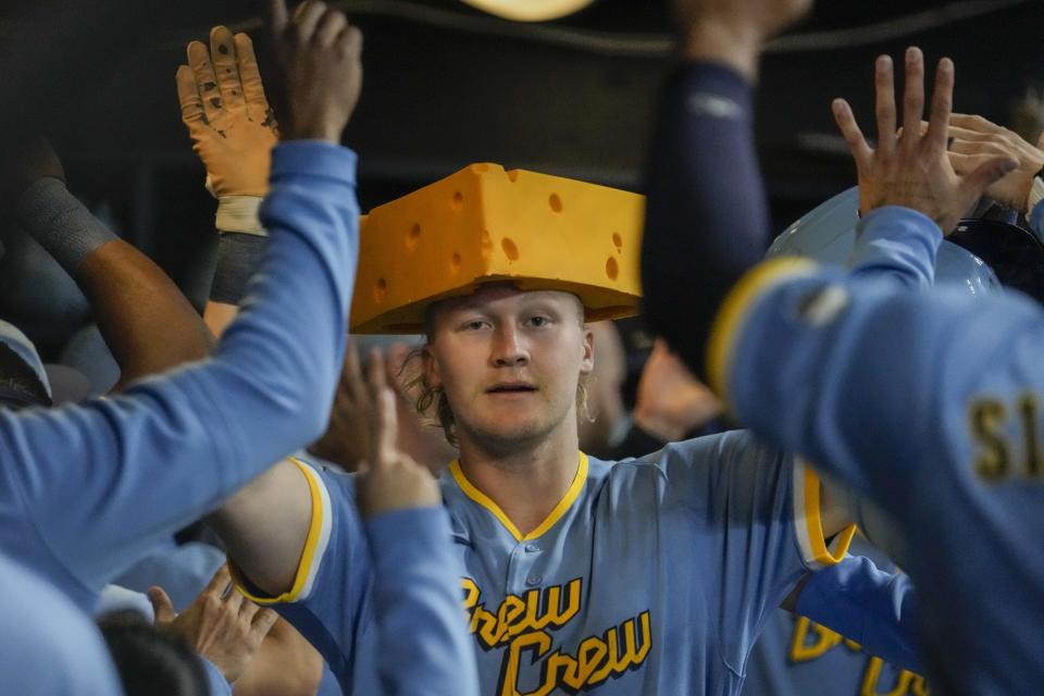 Milwaukee Brewers' Joey Wiemer is congratulatecd after hitting a two-run home run during the third inning of a baseball game against the Baltimore Orioles Wednesday, June 7, 2023, in Milwaukee. (AP Photo/Morry Gash)