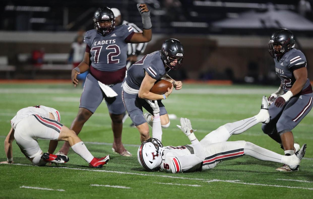 Benedictine quarterback Luke Kromenhoek drives for yardage on Friday, November 24, 2023 against North Oconee.