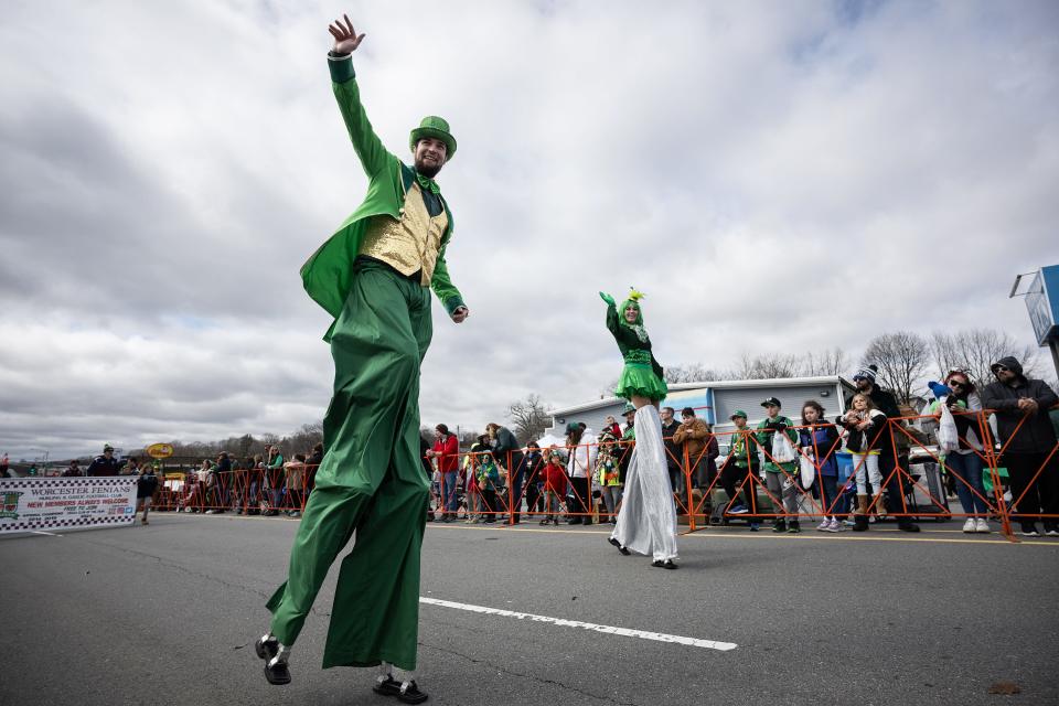 Performers march on stilts during the Worcester County St. Patrick’s Parade Sunday.