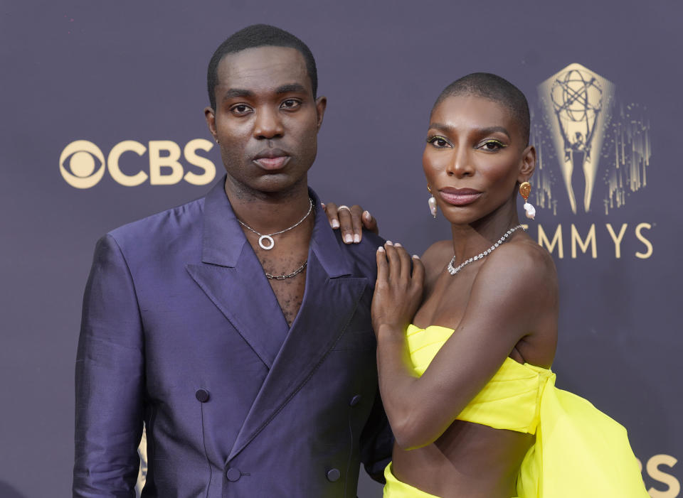 Paapa Essiedu, left, and Michaela Coel arrive at the 73rd Primetime Emmy Awards on Sunday, Sept. 19, 2021, at L.A. Live in Los Angeles. (AP Photo/Chris Pizzello)