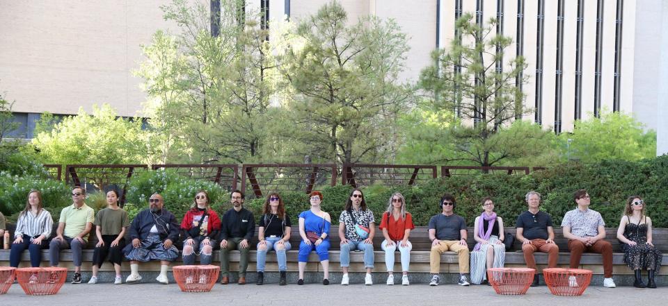 Opening-night attendees engage in a mindfulness exercise during Oklahoma City Repertory Theatre's 2022 premiere presentation of "Of a Mind: Oklahoma City," a guided theatrical audio tour through part of downtown OKC.