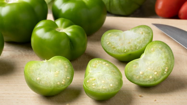 sliced tomatillos on cutting board