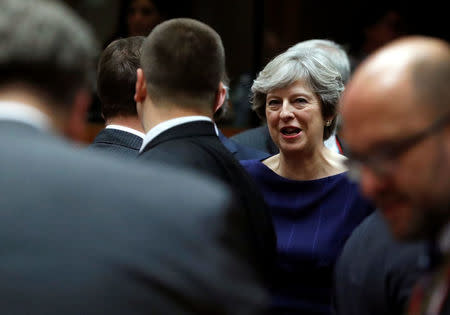 Britain's Prime Minister Theresa May (C) attends the EU summit in Brussels, Belgium October 19, 2017. REUTERS/Yves Herman