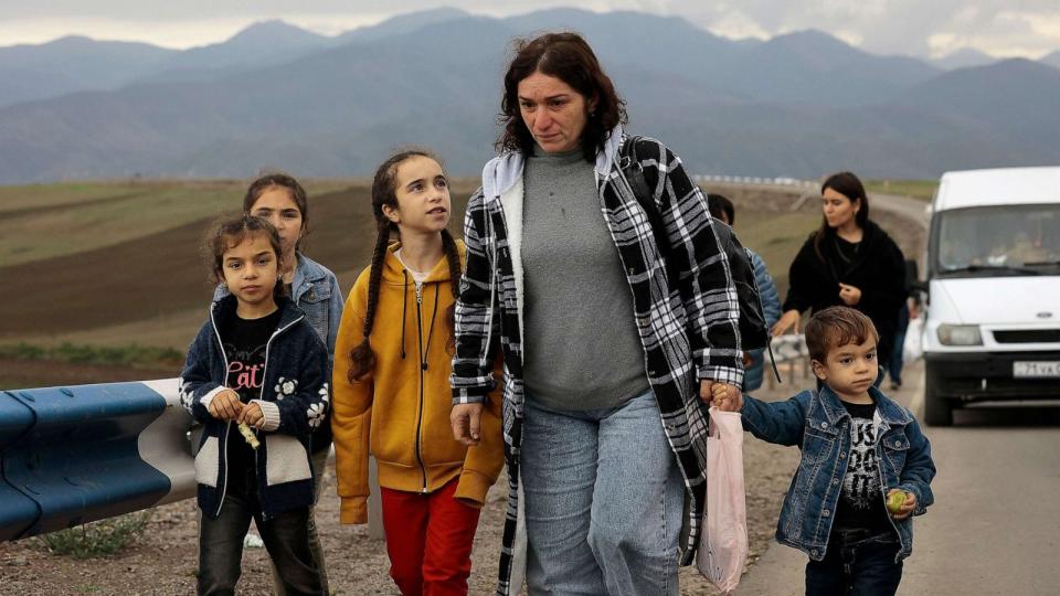 PHOTO: Ethnic Armenians fleeing Nagorno-Karabakh walk on a road to Kornidzor, in Armenia's Syunik region, Sept. 26, 2023. (Vasily Krestyaninov/AP)