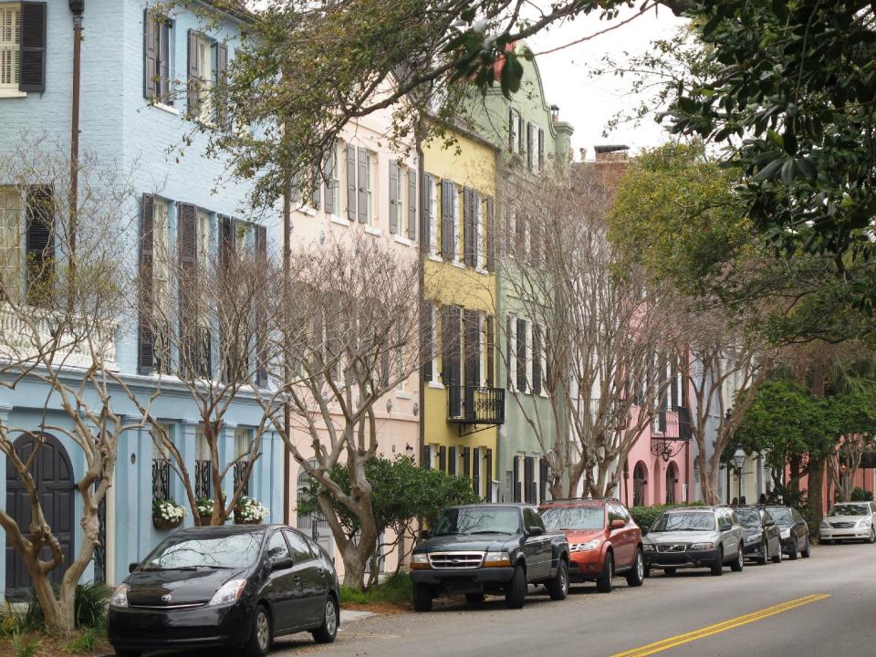 One of the most iconic vistas in Charleston, S.C., Rainbow Row, is seen in this March 11, 2013 photograph. It's free to walk through the city's historic district to see these and other historic homes. (AP Photo/Bruce Smith)