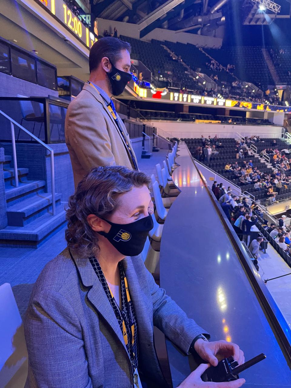 Mel Raines (sitting) and Danny Lopez of Pacers Sports & Entertainment gave IndyStar a tour of Gainbridge Fieldhouse renovations. Where Raines sits in the new Terrace Table seating is among the best seats in the house, she said.