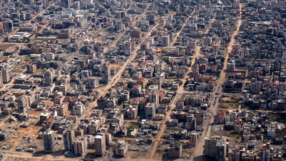 PHOTO: Destroyed buildings are seen through the window of a U.S. Air Force airplane flying over the Gaza Strip, Mar. 14, 2024.  (Leo Correa/AP)