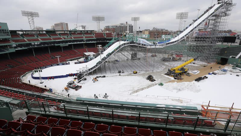 A ramp constructed for the Big Air at Fenway skiing and snowboarding U.S. Grand Prix tour event is covered in snow at Fenway Park on Feb. 10, 2016, in Boston. Fenway Park has kept busy in the offseason with hockey, football and other events that have turned one of baseball’s crown jewels into a year-round venue.