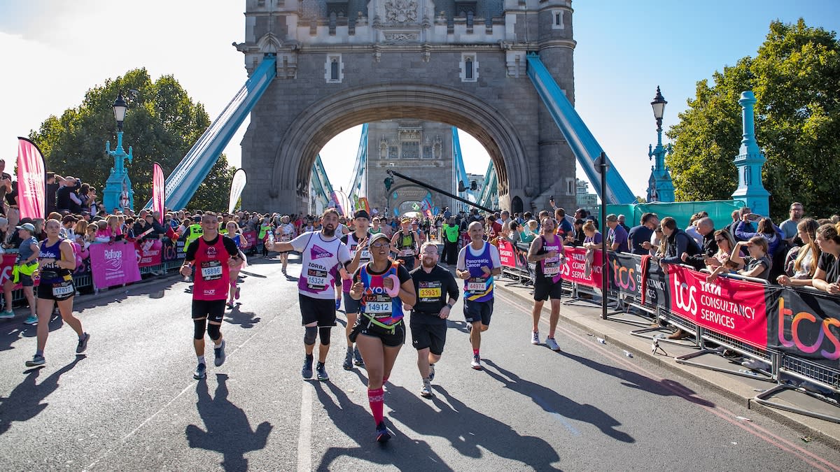  Runners leaving Tower Bridge during the London Marathon 2022. 