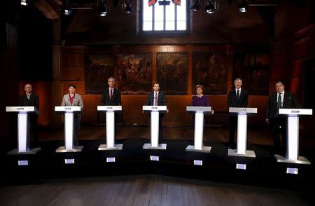 Patrick Harvie (Green), Ruth Davidson (Conservative), Jim Murphy (Scottish Labour), BBC's James Cook, Nicola Sturgeon (SNP), Willie Rennie (Lib Dem) and David Coburn (UKIP) pose for a photograph before taking part in the BBC Scotland leaders' debate in Aberdeen, Scotland, April 8 2015. REUTERS/Russell Cheyne