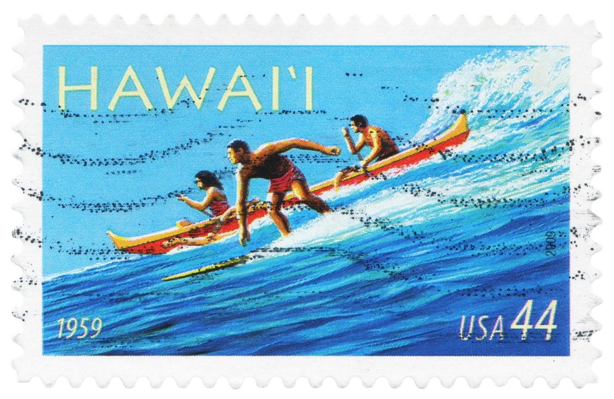 US postage stamp: people are surfing on the sea