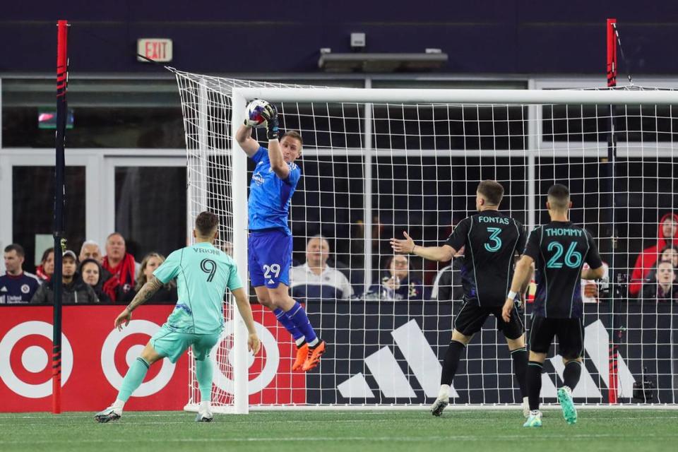 Sporting Kansas City goalkeeper Tim Melia leaps to save a shot against the <a class="link " href="https://sports.yahoo.com/soccer/teams/new-england/" data-i13n="sec:content-canvas;subsec:anchor_text;elm:context_link" data-ylk="slk:New England Revolution;sec:content-canvas;subsec:anchor_text;elm:context_link;itc:0">New England Revolution</a>. Paul Rutherford/USA TODAY Sports