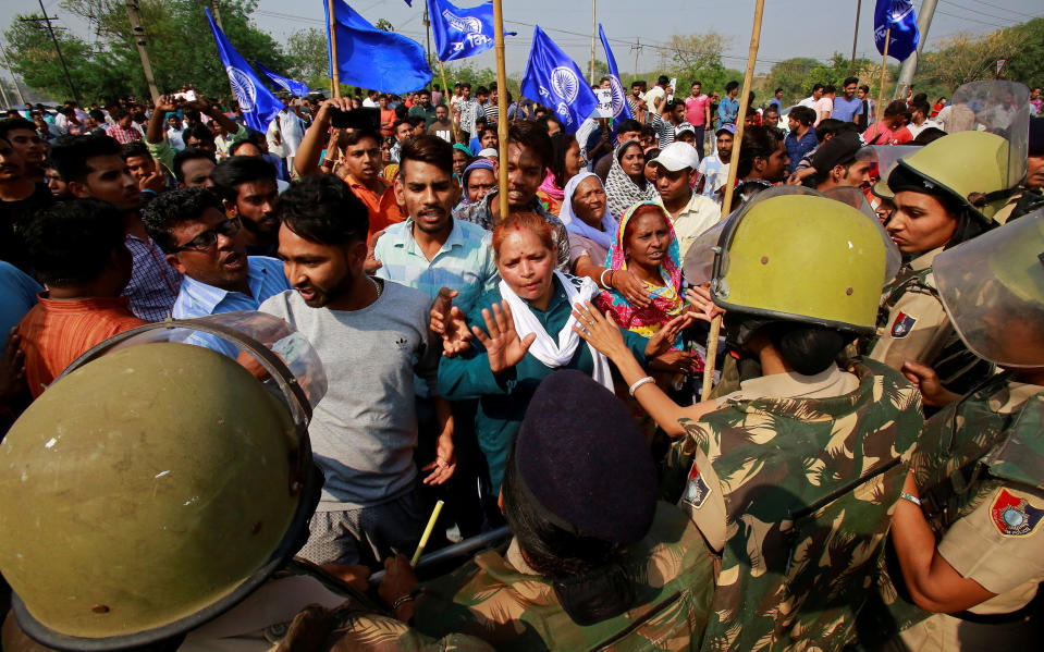 Image: Police try to stop dalit community members during a protest (Ajay Verma / Reuters)