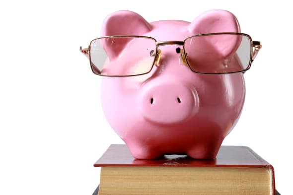 piggy bank with glasses and...