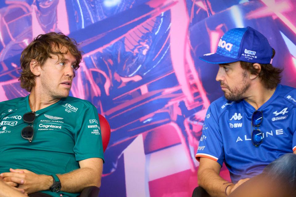 Alpine's Spanish driver Fernando Alonso (R) speaks to Aston Martin's German driver Sebastian Vettel at a press conference before the first practice session for the Canada Formula 1 Grand Prix on June 17, 2022, at Circuit Gilles-Villeneuve in Montreal. (Photo by Geoff Robins / AFP) (Photo by GEOFF ROBINS/AFP via Getty Images)