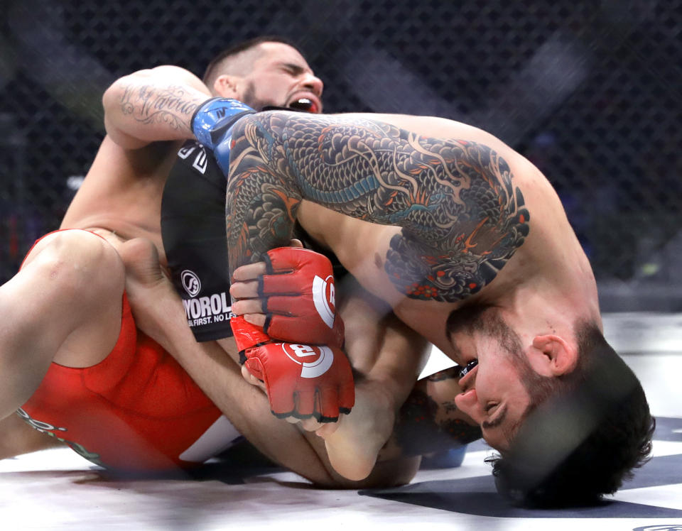 Dillon Danis, right, fights Kyle Walker in a mixed martial arts bout for the welterweight at Bellator 198, Saturday, April 28, 2018, in Rosemont, Ill. (AP Photo/Nam Y. Huh)