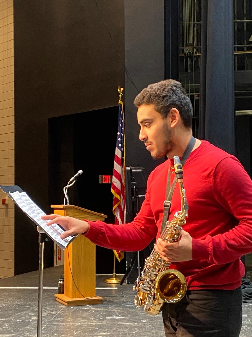 Taunton High School senior Caio Dos Santos-Amado practices the saxophone on Feb. 1, 2023 in the auditorium.