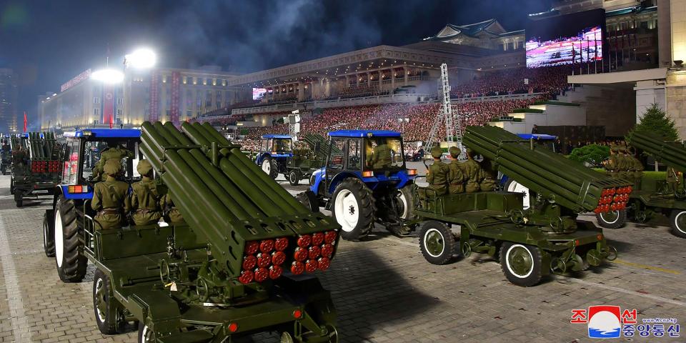 view from back of rocket launchers pulled by tractors