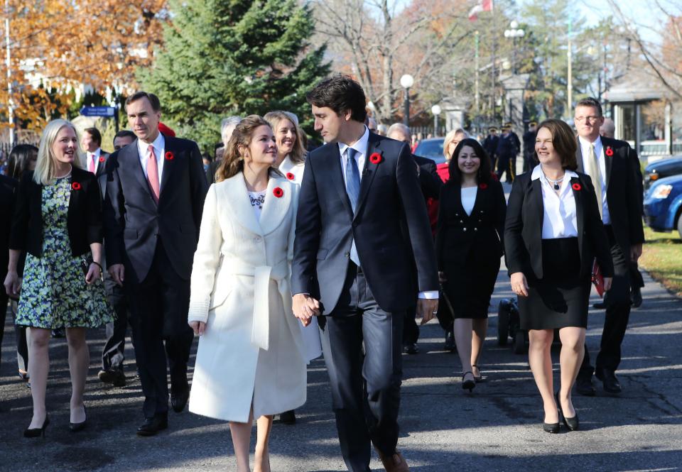 Incoming Canadian Prime Minister Justin Trudeau and his wife Sophie Gregoire arrive with his cabinet before his swearing-in as Canada's 23rd prime minister at Rideau Hall in Ottawa on November 4, 2015.  AFP PHOTO/POOL/BLAIR GABLE (Photo by - / POOL / AFP) (Photo by -/POOL/AFP via Getty Images)
