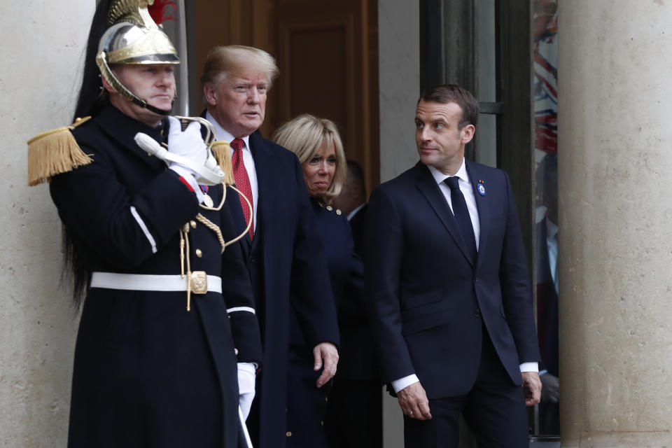 French President Emmanuel Macron, right, his wife Brigitte and President Donald Trump leave the Elysee Palace after their talks and lunch in Paris, Saturday, Nov.10, 2018. Trump is joining other world leaders at centennial commemorations in Paris this weekend to mark the end of World War I. (AP Photo/Thibault Camus)