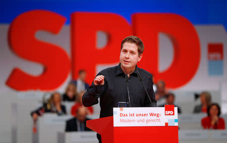 FILE PHOTO: Kevin Kuehnert, the head of the SPD’s youth wing, speaks during an SPD party convention in Berlin, Germany, December 7, 2017. REUTERS/Fabrizio Bensch/File Photo