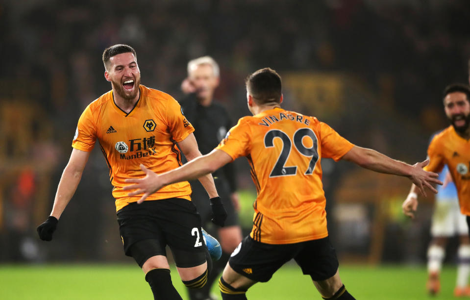 Wolverhampton Wanderers' Matt Doherty (left) celebrates scoring his side's third goal of the game with Ruben Vinagre during the Premier League match at Molineux, Wolverhampton. (Photo by Nick Potts/PA Images via Getty Images)