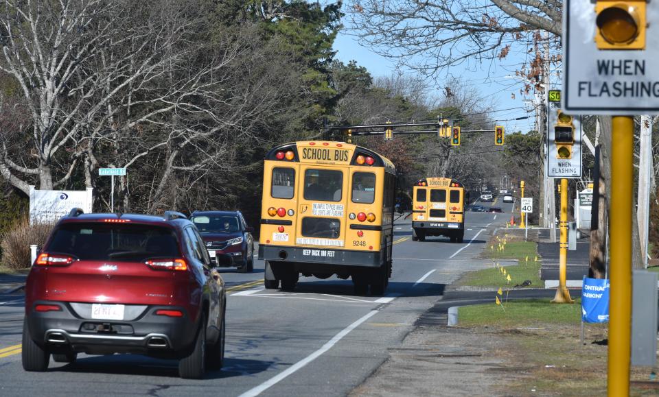 Morning traffic navigates Station Avenue in South Yarmouth along a stretch of roadway near schools, in January.