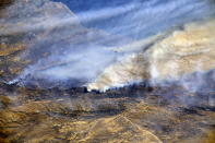 <p>From a Dec. 8, 2017, International Space Station flyover of Southern California, NASA astronaut Randy Bresnik photographed the plumes of smoke rising from wildfires. (Photo: NASA) </p>