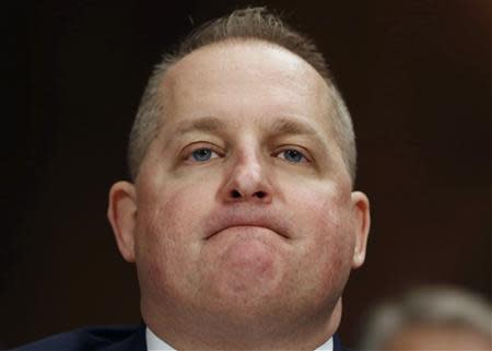 Chief Financial Officer and executive vice president of Target John Mulligan listens to a question while testifying at the Senate Judiciary Committee hearing about Privacy in the Digital Age on Capitol Hill in Washington, February 4, 2014. REUTERS/Larry Downing