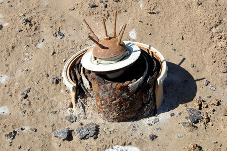 An anti-tank mine is seen near the village of Bitr, which in Arabic means "amputation", in Shalamjah district, east of Basra, Iraq March 4, 2018. REUTERS/Essam Al-Sudani