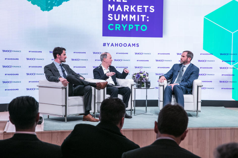 L-R: Yahoo Finance’s Daniel Roberts and Andy Serwer interview Ripple CEO Brad Garlinghouse at the Yahoo Finance All Markets Summit: Crypto on Feb. 7, 2018. (Gino DePinto/Oath)