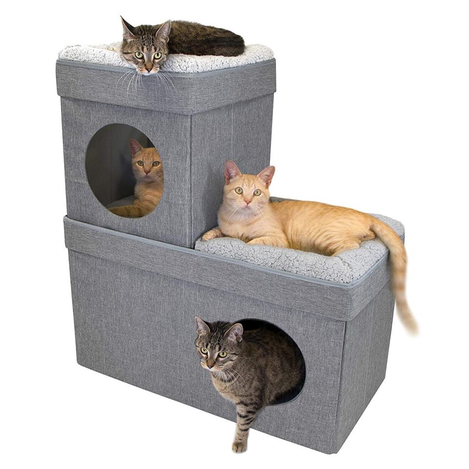 Cats lying on a Kitty City Large Stackable Tan Cat Condo