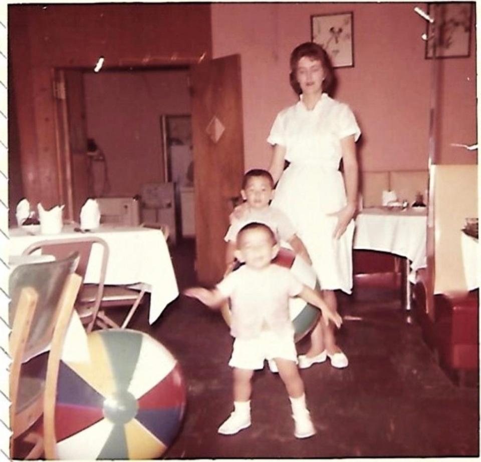 The Cheung children often played and ate at their parents' restaurant, Chopstick Charley's. This 1964 picture shows brothers Garry and Larry and their Aunt Jo, who waitressed there.