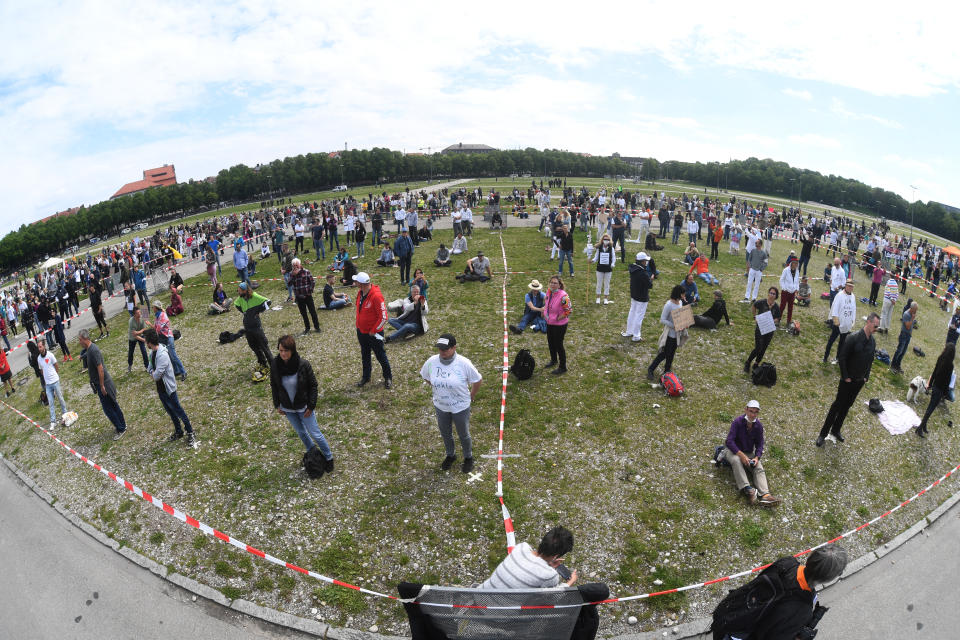 16 May 2020, Bavaria, Munich: Participants in a demonstration against the anti-corona measures of politics stand at the Theresienwiese at the prescribed distance. Photo: Felix Hörhager/dpa (Photo by Felix Hörhager/picture alliance via Getty Images)