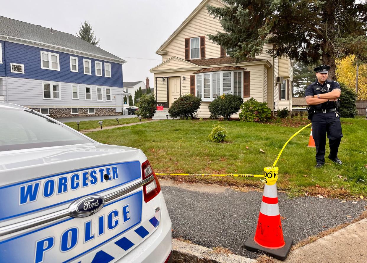 In a file photo, the house at 480 Burncoat St., Worcester, is surrounded by crime scene tape and Worcester Police officers on Oct. 24, 2022.