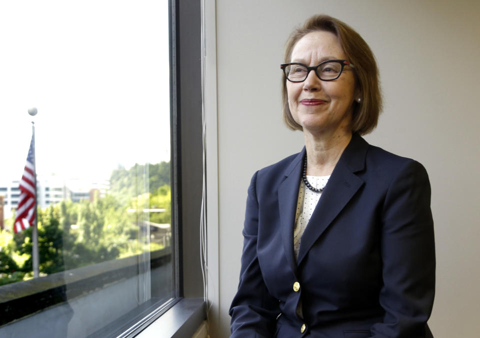 FILE - In this July 13, 2016 file photo, Oregon Attorney General Ellen Rosenblum poses for a photo at her office in Portland, Ore. Oregon's attorney general is telling the U.S. Supreme Court that Oregon's criminal justice system would be "overwhelmed" if the nation's highest court rules that nonunanimous jury verdicts are unconstitutional. If the U.S. Supreme Court finds nonunanimous juries unconstitutional, Rosenblum said in a brief filed Friday, Aug. 23, 2019, it could invalidate hundreds of convictions in Oregon. (AP Photo/Don Ryan, File)