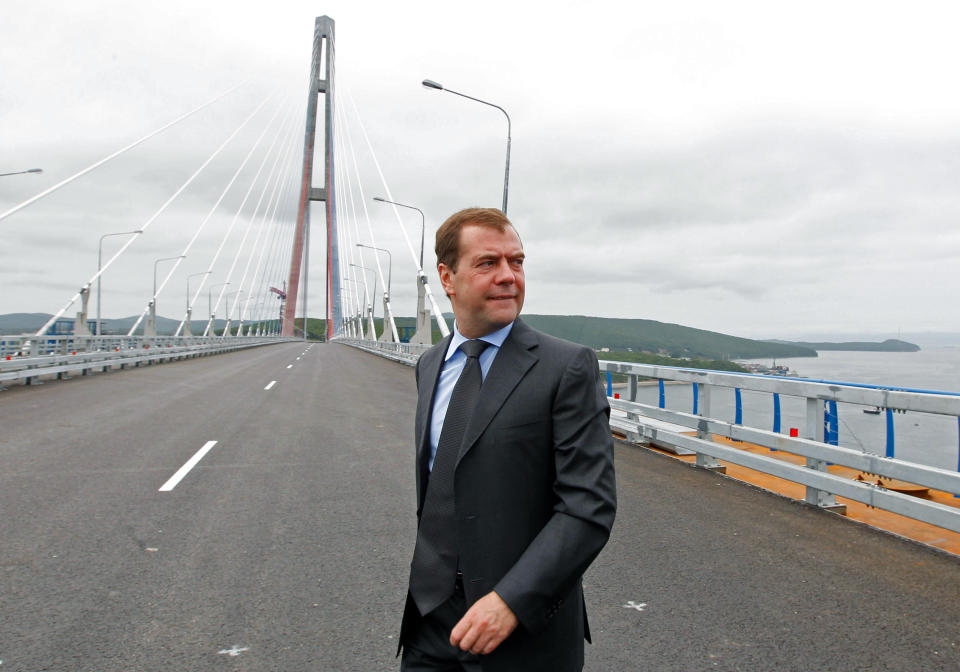 Russian Prime Minister Dmitry Medvedev walks on the cable-stayed Russky Island Bridge in Vladivostok on Monday, July 2, 2012. Medvedev arrived in Vladivostok beginning his four-day visit to the Russian Far East along with 10 ministers, which is expected to include a trip to one of the Russian-held islands off Hokkaido claimed by Japan.(AP Photo/RIA Novosti, Dmitry Astakhov, Government Press Service)