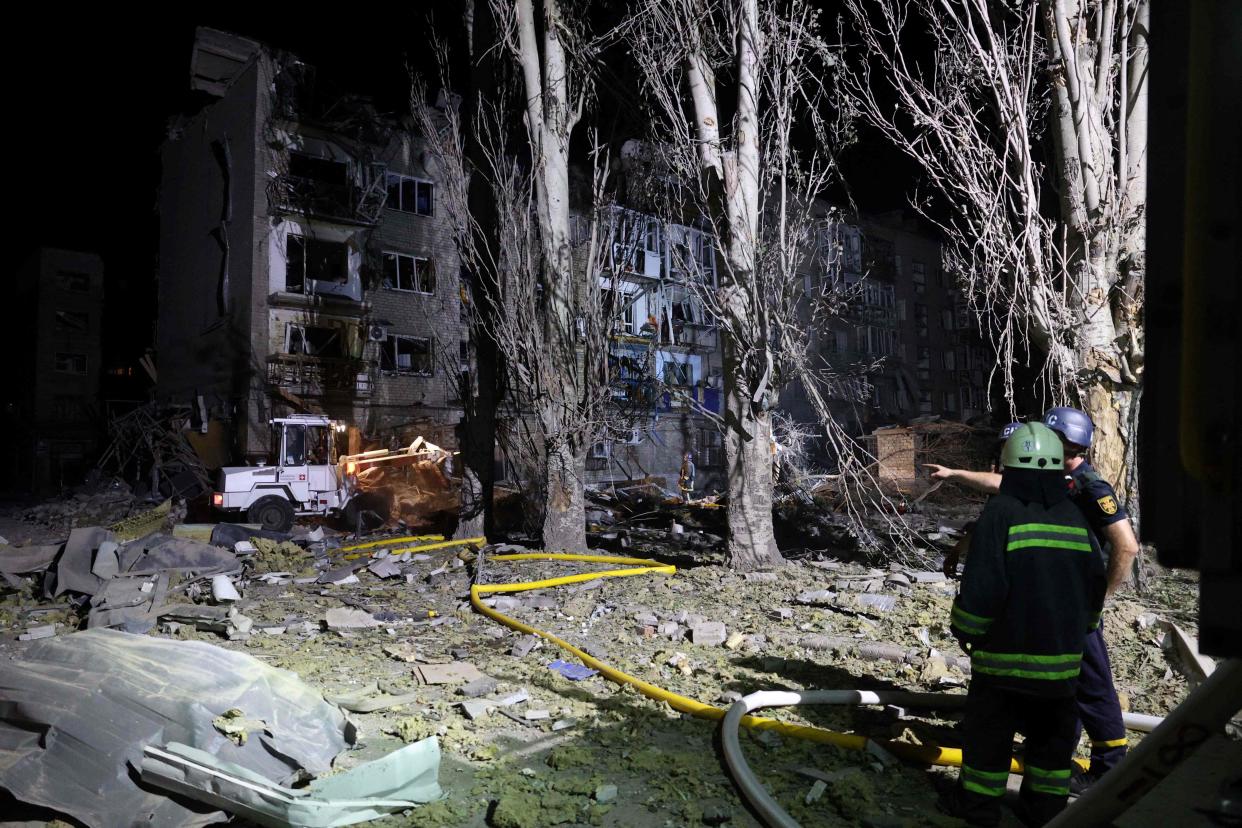 Rescuers are at work near a damaged residential building following Russian missiles strikes in Pokrovsk (AFP via Getty Images)