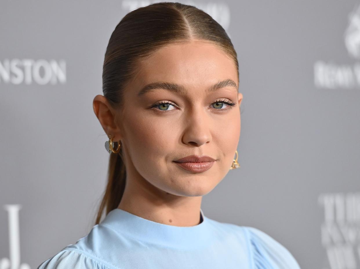 Gigi Hadid said that she voted via absentee ballot with her daughter by her side.