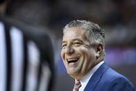 Auburn head coach Bruce Pearl smiles at an official during the first half of an NCAA college basketball game against Tennessee Saturday, Feb. 22, 2020, in Auburn, Ala. (AP Photo/Julie Bennett)