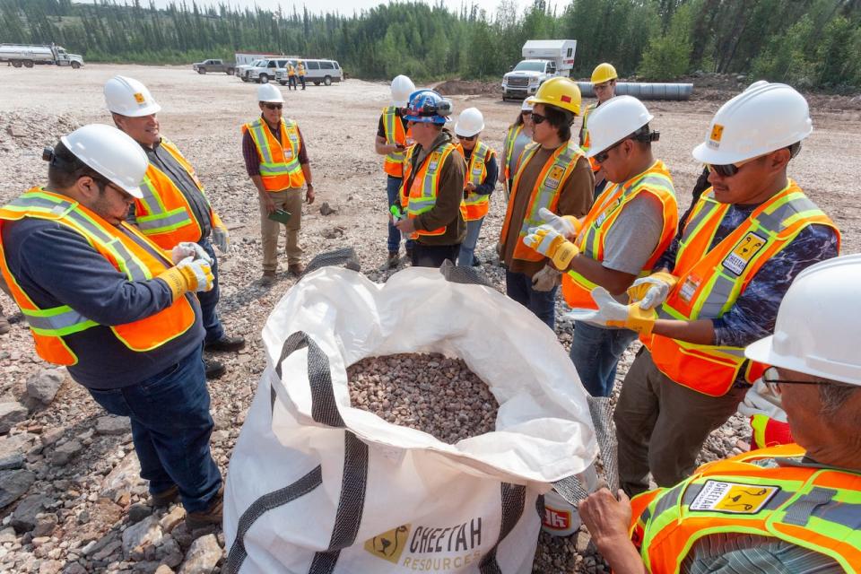 Members of the Yellowknives Dene First Nation look at the first bastnaesite concentrate produced on July 21, 2021 at the Cheetah Resources’ Nechalacho Project near Yellowknife.