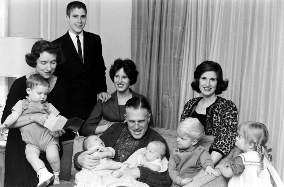 Caption from February, 1962, issue of LIFE. "After Sunday services the Romneys crowd onto a sofa in living room. Son Mitt and married daughters Jane and Lynn are at the rear. From left, grandchildren are Gregory (held by Lenore), Douglas, Susan, Brett and Jody. Another son, Scott, is in England with a mission group." (Francis Miller—Time & Life Pictures/Getty Images) <br> <br> <a href="http://life.time.com/history/mitt-romney-photos-from-the-gop-candidates-early-years/#1" rel="nofollow noopener" target="_blank" data-ylk="slk:Click here to see the full collection at LIFE.com;elm:context_link;itc:0;sec:content-canvas" class="link ">Click here to see the full collection at LIFE.com</a>