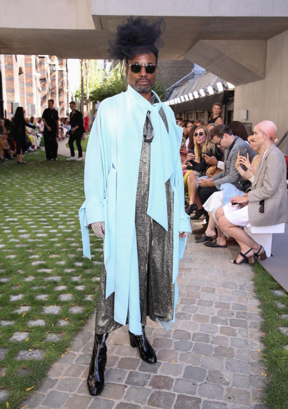 <p>The star wore a baby blue overcoat and grey printed dress to the Roland Mouret SS20 show at London Fashion Week.</p><p>He styled the look with a black tulle hat, black heeled boots and a pair of aviator-style sunglasses. <br></p>