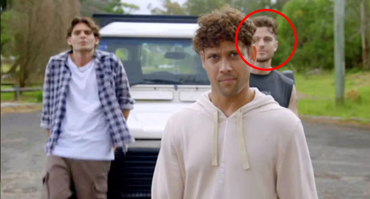 Home and Away's Joshua Orpin standing behind Kyle Shilling.